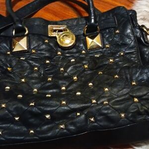 Vintage Michael Kors Hand Bag has the lock on great design